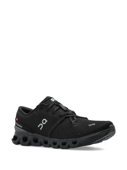 On Running Cloud X 4 sneakers in the Black Eclipse colorway