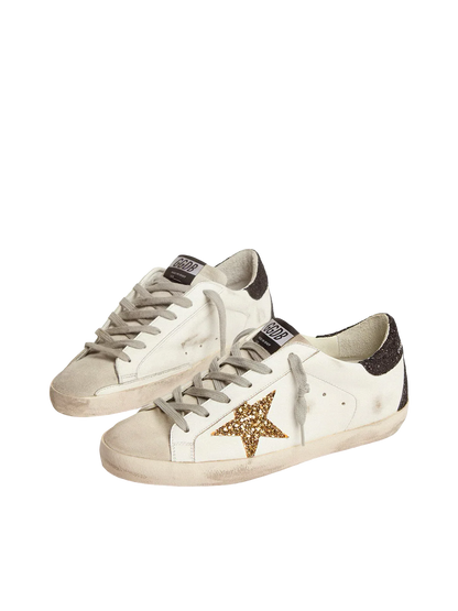 Golden   goose   Women’s   Super-Star   in   nappa   leather   with   gold   glitter   star   and   black   glitter   heel   tab