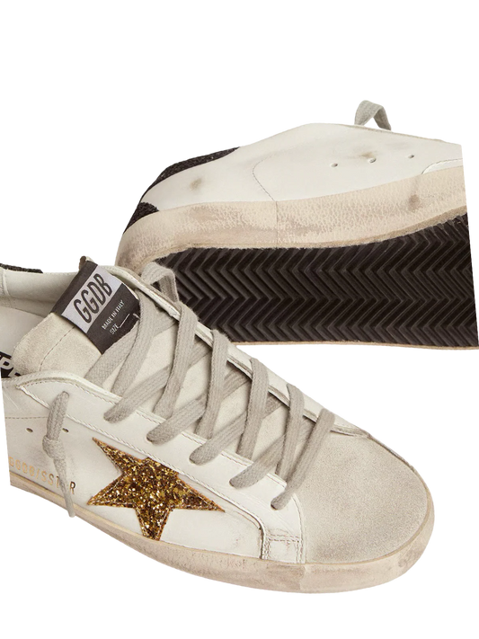 Golden   goose   Women’s   Super-Star   in   nappa   leather   with   gold   glitter   star   and   black   glitter   heel   tab