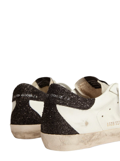 Golden   goose   Women’s   Super-Star   in   nappa   leather   with   gold   glitter   star   and   black   glitter   heel   tab
